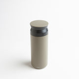 This Kinto Travel Tumbler provides an elegant solution for drinking beverages either at home or on the go. The vacuum-insulated design can keep drinks either hot or cold for up to six hours. Color: khaki. 2" x 7.9"/17 oz.
