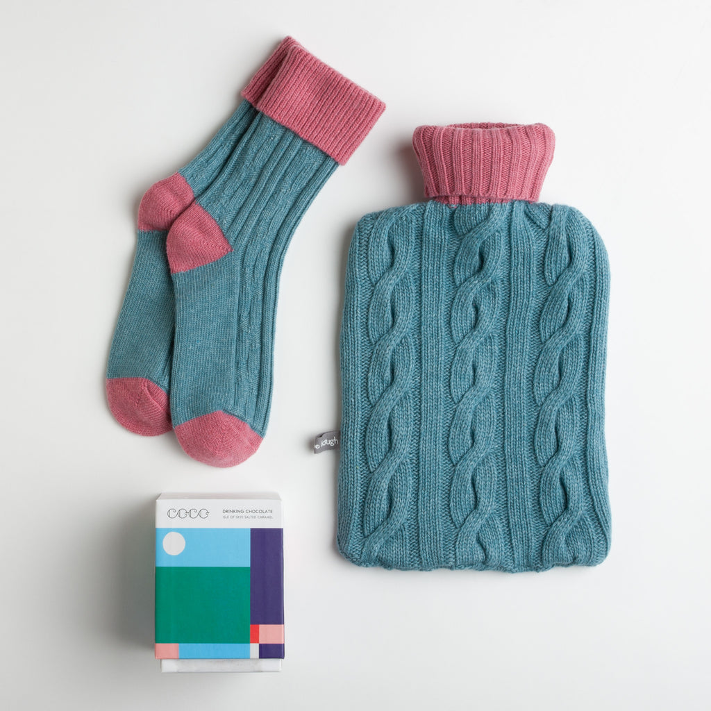 The winter blues have a whole new meaning with this sumptuous sock and hot water bottle combo. Accompanied by a delightful box of salted caramel drinking chocolate with colorful artwork by Parisian studio Les Canailles.