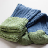 Cashmere mix slouch socks by Catherine Tough: These cozy socks are ideal as bed socks, but can be worn with boots or shoes. Denim blue with celery rib, heel & toes. Cashmere/lambswool/viscose blend.