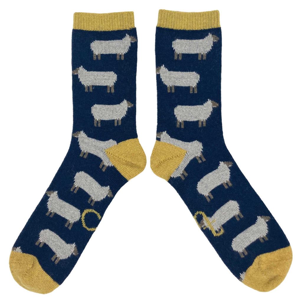 Made from naturally insulating lambswool, these whimsical socks are cozy enough for bedsocks and rugged enough to wear with boots. Oatmeal sheep on navy base with lemon rib, heel and toe.