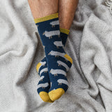 Made from naturally -insulating lambswool, these whimsical socks are cozy enough for bedsocks and rugged enough to wear with boots. Oatmeal sheep on navy base with lemon rib, heel and toe.