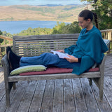Teal ruana: a cozy blend of wood and alpaca provides a luxurious layer of warmth. This versatile piece is perfect for watching a movie on the couch - or at the theater. Made in Peru.