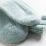 Falke bed socks: Fluffy angora mix socks in peppermint are meant to be worn while lounging and keep feet toasty-warm. They are produced by a family-owned business that has been making premium socks since 1865 and are known for their "perfect FALKE fit" and the soft, non-constricting cuff. Made in Germany.