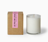 Le Feu De L'eau candle in petale. A 3 oz. votive in the bewitching scent of tuberose, white iris, and orange peel. Made of coconut apricot wax with a lead-free cotton wick. Burn time: 17 hours. Natural fragrance. No phthalates, parabens, sulfates, ethanol, mineral oils, petroleum distillates, or preservatives. Made in the USA. Packaged in kraft cardboard box.