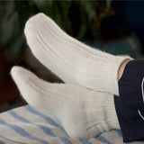 Falke bed socks - Fluffy ivory angora socks are meant to be worn in bed to keep feet toasty-warm.
