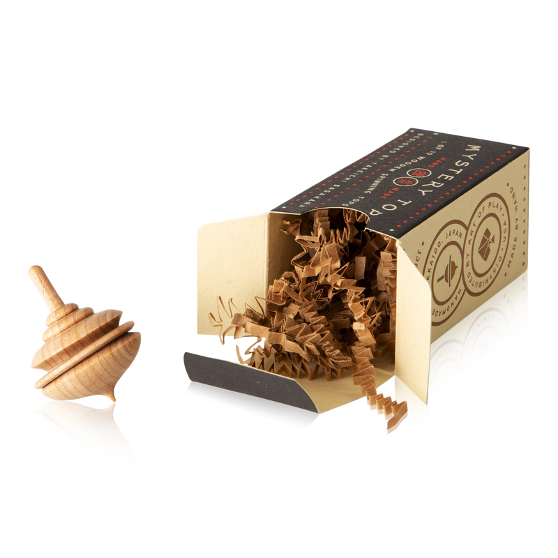 This wooden top celebrates classic design styles like Art Nouveau and Bauhaus. Each box is a surprise, containing one of ten different tops. 