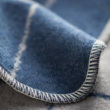 Indigo and grey "squared" reversible blanket by David Fussenegger is made in Austria at a company that has been producing premium textiles since 1832.