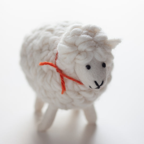 "Wooliford" is a steadfast sheep you can count on. Product Details: Size: 5" x 8". Made from 100% organic wool. Hand-crafted in Nepal at small family-owned work shop that follows Fair Trade practices.