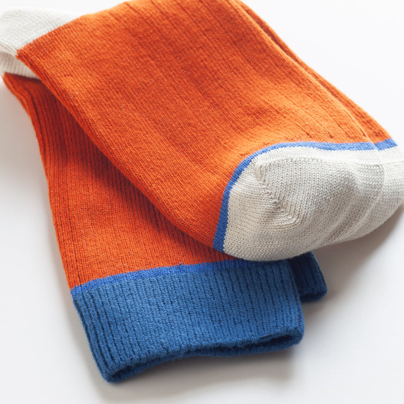   Rust Color Block Socks by Catherine Tough:&nbsp; These colorful thick cotton crew socks are made from soft organic cotton. Cozy enough for bed socks and durable enough to wear with boots. Machine washable. Fits Men's shoe size 8.5-11.5.