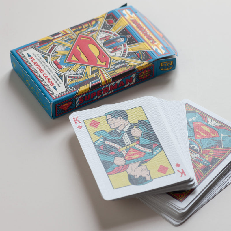 Superman playing cards by Theory: These vibrant playing cards are a tribute to the very first superhero! The motif is based on the original DC comics and the face cards feature iconic characters such as Lois Lane, Lex Luthor, General Zod, and Krypto the Superdog.