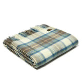 Folded Dress Stewart tartan lambswool throw in with fringe on a white background