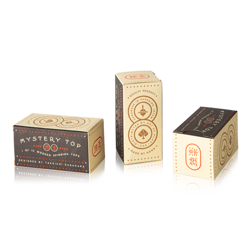Three closed boxes of "mystery tops."