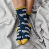 Made from naturally -insulating lambswool, these whimsical socks are cozy enough for bedsocks and rugged enough to wear with boots.  Oatmeal sheep on navy base with lemon rib, heel and toe.