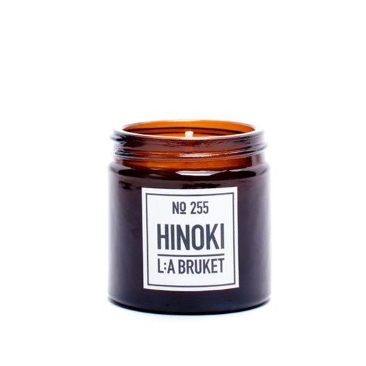 LA Bruket's 50 gram soy candle is in a handsome amber glass. HInoki's soothing aroma is conducive to relaxation and contains notes of pine, cypress, citrus and nutmeg provide a woody fresh and spicy scent.