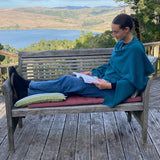 Teal ruana:  a cozy blend of wood and alpaca provides a luxurious layer of warmth. This versatile piece is perfect for watching a movie on the couch - or at the theater. Made in Peru.