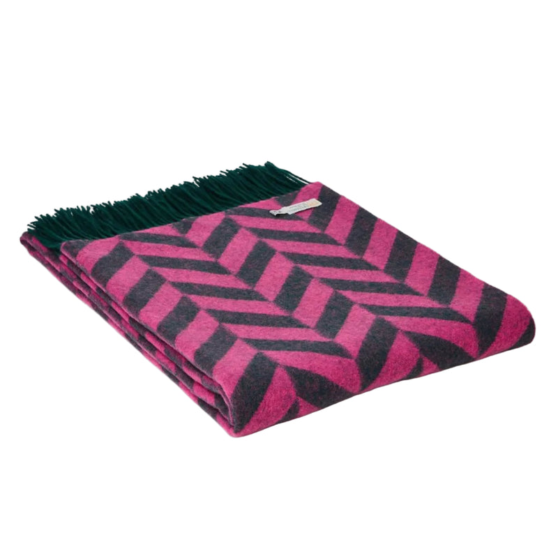 Pink and emerald lambswool blanket in a chunky chevron pattern.