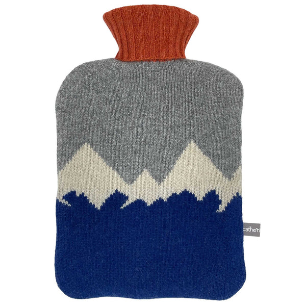 This 100% Merino lambswool water bottle set boasts a handsome mountain design in blue, cream, grey, and orange.