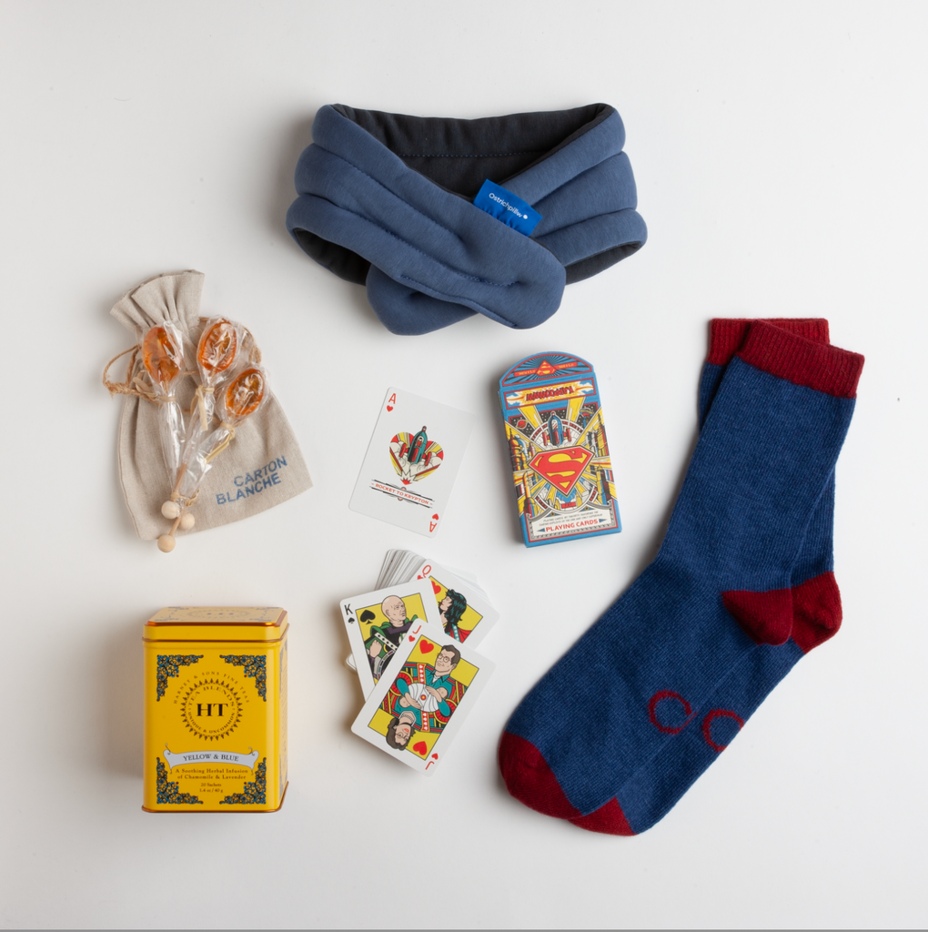 This cozy care package is built for the hero who's temporarily out of commission — whether they're fighting off a cold, recovering from surgery, or just in need of some serious downtime. Both loungers and wayfarers should enjoy these warm lambswool socks, heated neck wrap, technicolor Superman™ cards, and calming chamomile and lavender tea.