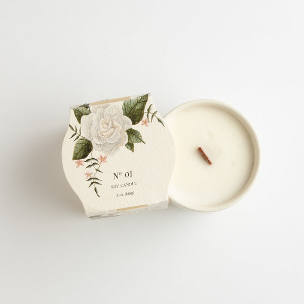 No. 01 Ceramic Botanical Candle by Simply Curated is a delicate blend of honeysuckle, plum and rose, with notes of pink jasmine, gardenia and lily of the valley. Soy wax with a clean burning wooden wick. Burn time: 30 hours, 5 oz.