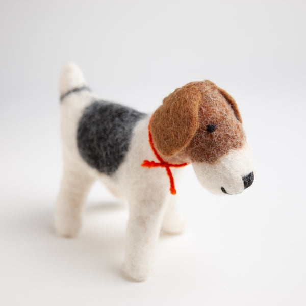 "Bartholomew" is an incredibly loyal felted dog and would make a friendly addition to any nightstand. 8" x 7"  Product Details:  Size:  8" x 7" Made from 100% organic wool Hand-crafted in Nepal at small family-owned work shop that follows Fair Trade practices.