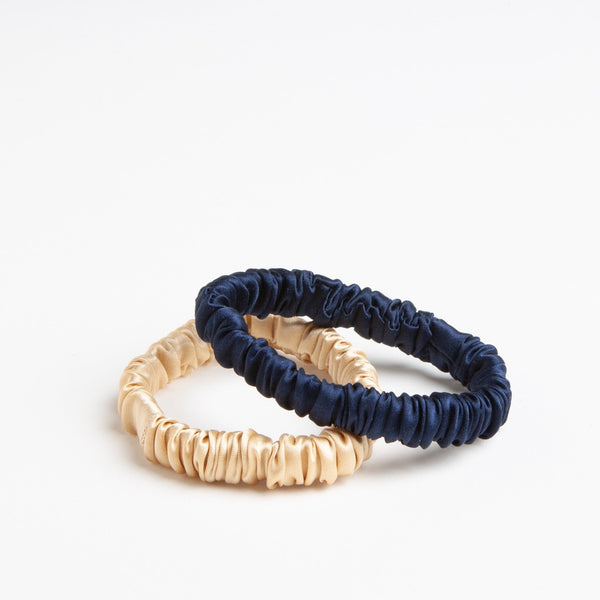One navy and one beige hair tie in mulberry silk.  Sturdy hair ties are gentle on your hair and won't pull or twist. 