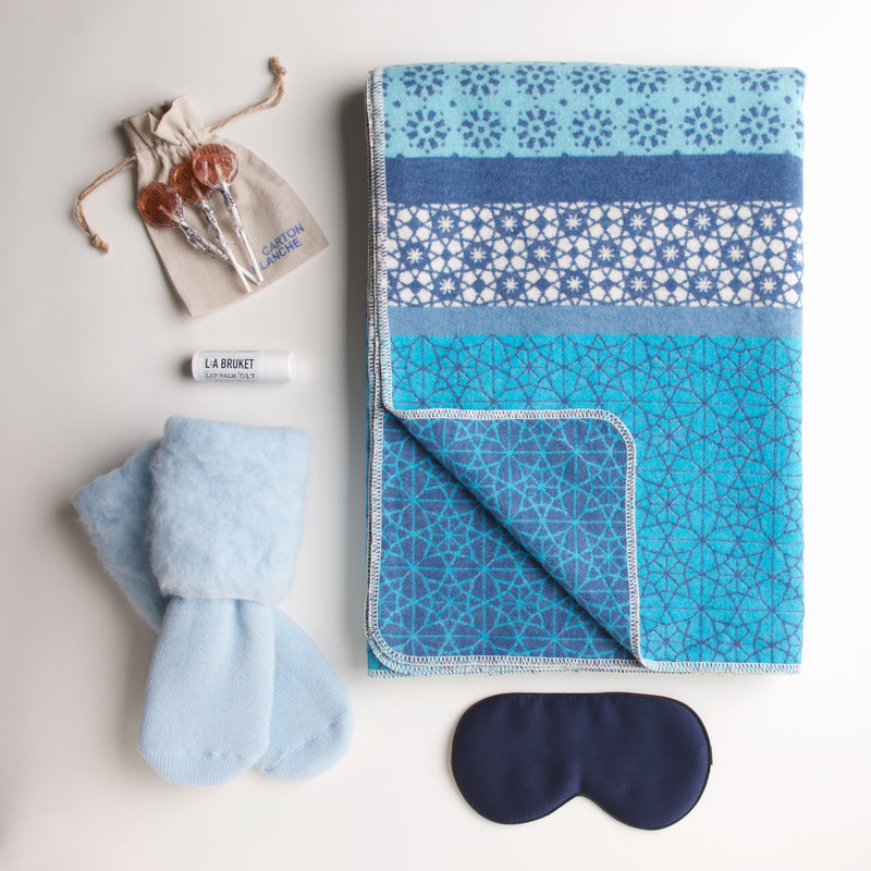 The coziest blanket and socks in our collection. A silk eye mask, soothing lip balm and all-natural strawberry lollipops ensure the patient will have a comfortable recuperation.