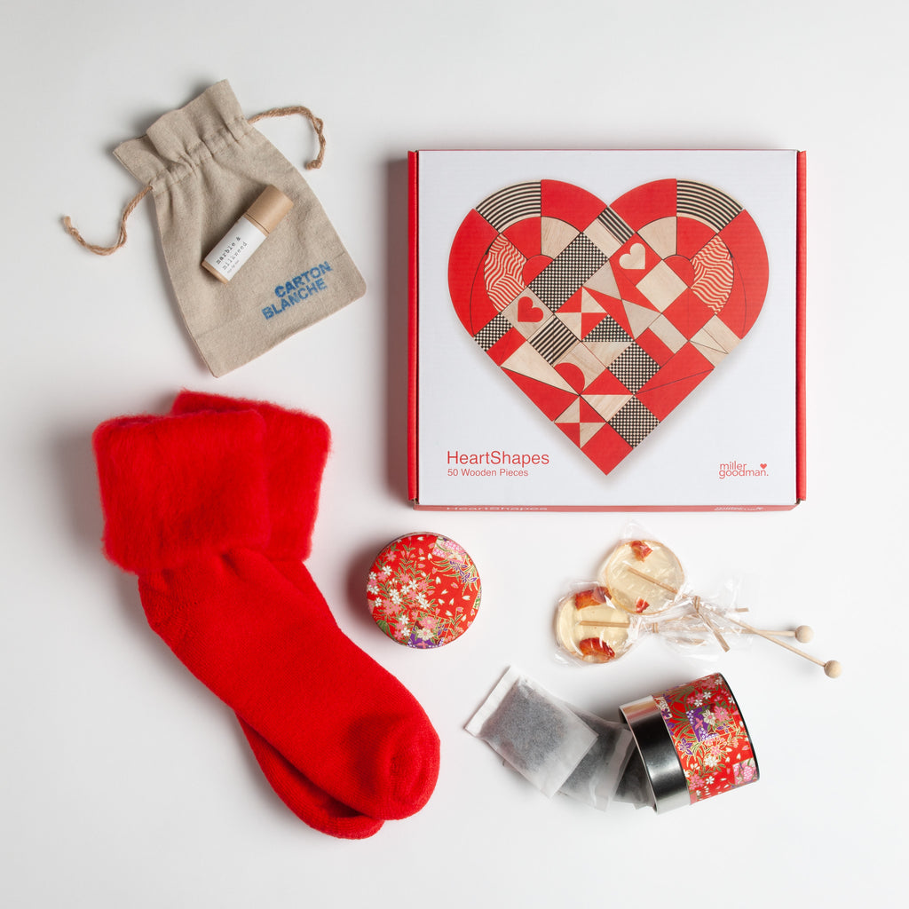 Perfect get well Valentine gift - Miller Goodman Heart Shapes puzzle, rosy lip tint, fuzzy red socks, floral canister filled with strawberry cream tea and a pair of of lovely lollipops.