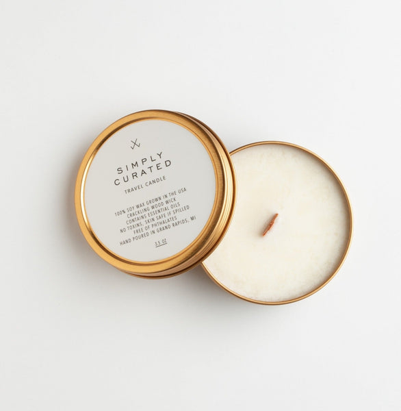 Grapefruit & Bergamot Travel Candle by Simply Curated is an uplifting blend of lemon, grapefruit and orange with notes of spicy sweet bergamot. Product Details: Burn time: 16 hours. Soy wax with a clean burning wooden wick.  4 oz tin, 3" x 1."  Made in Michigan.